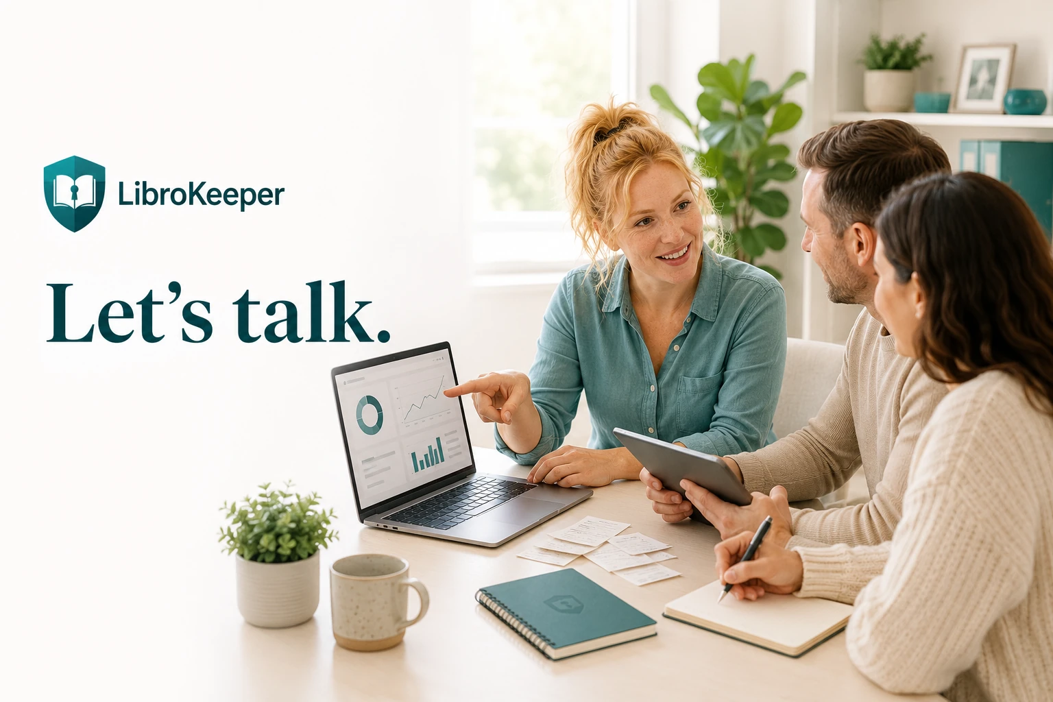 A LibroKeeper advisor discussing bookkeeping records with two business owners